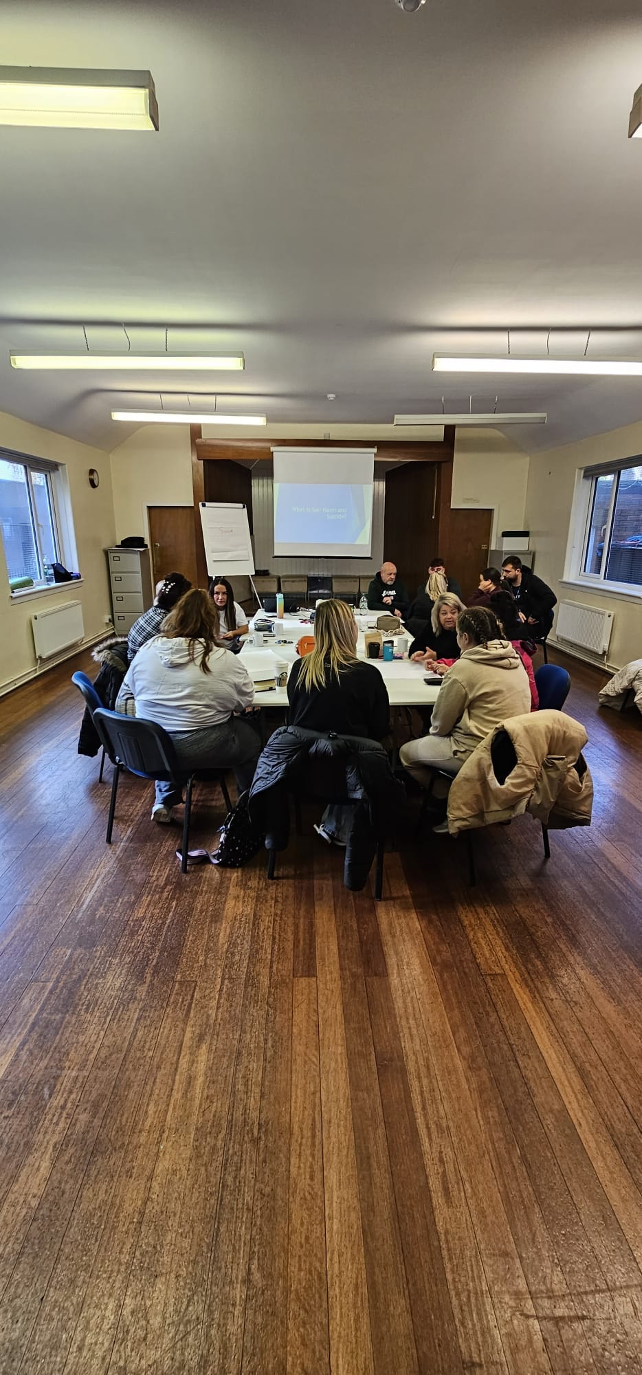 Circle of people doing work