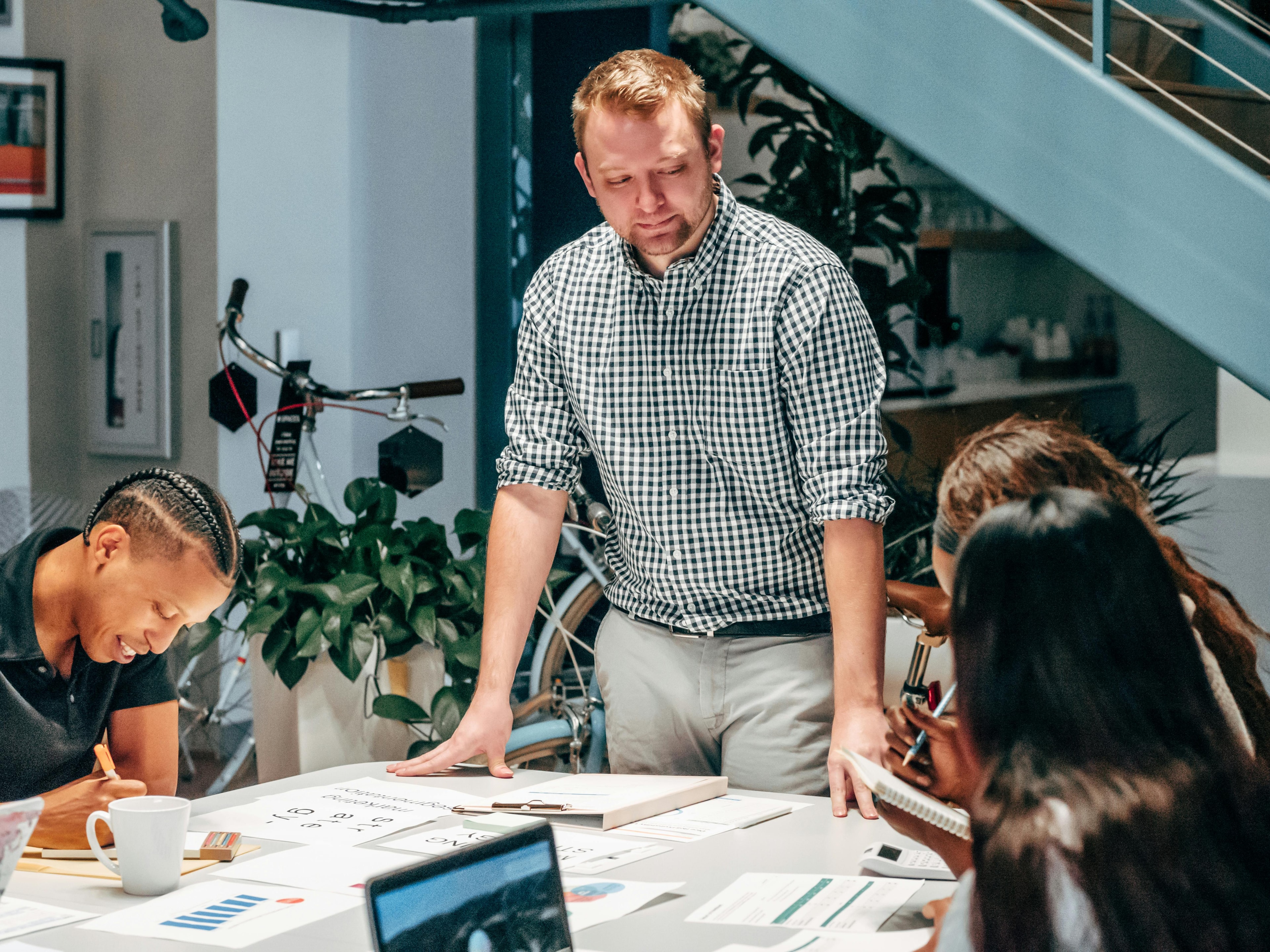 Man looking down at team