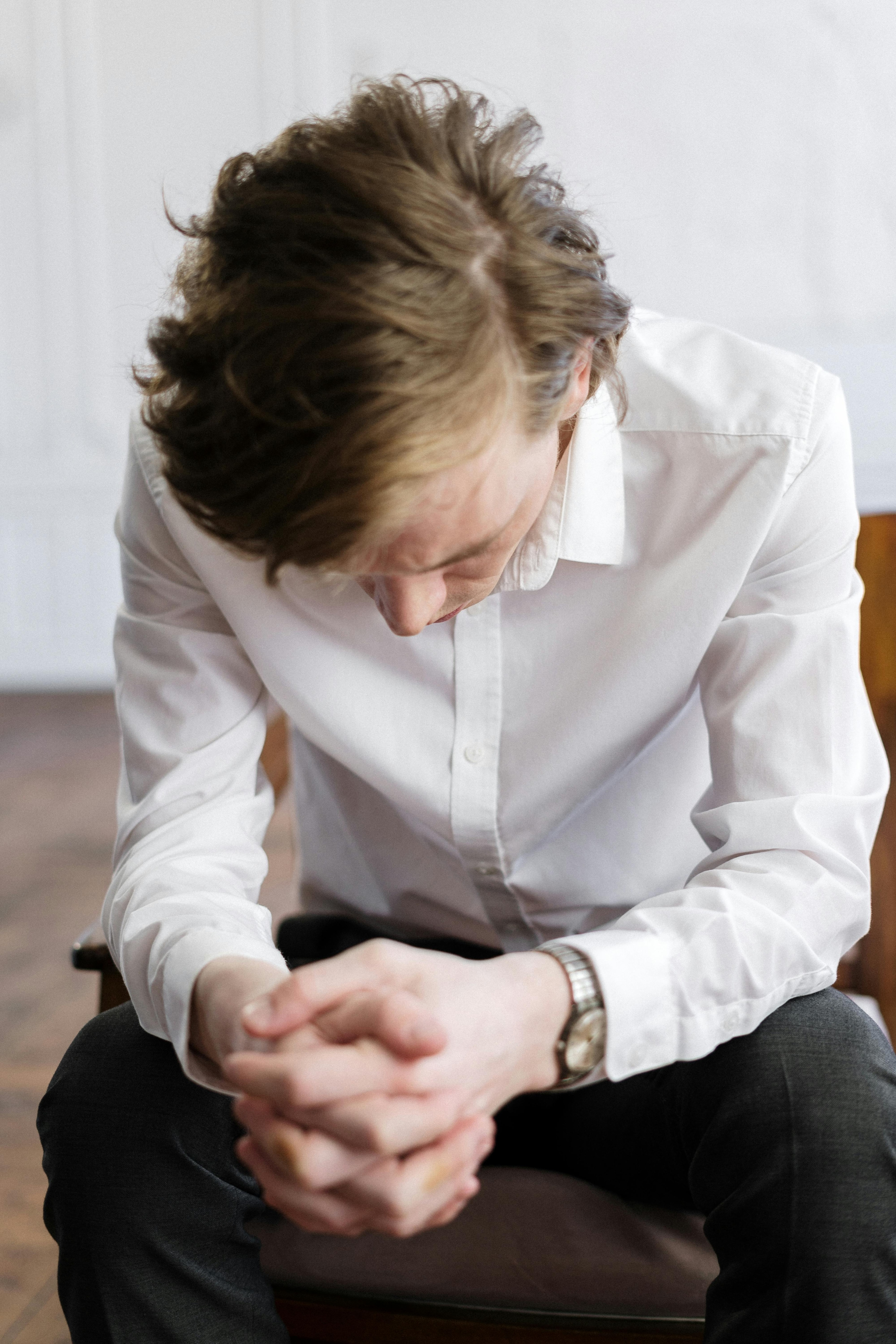 Man looking at floor