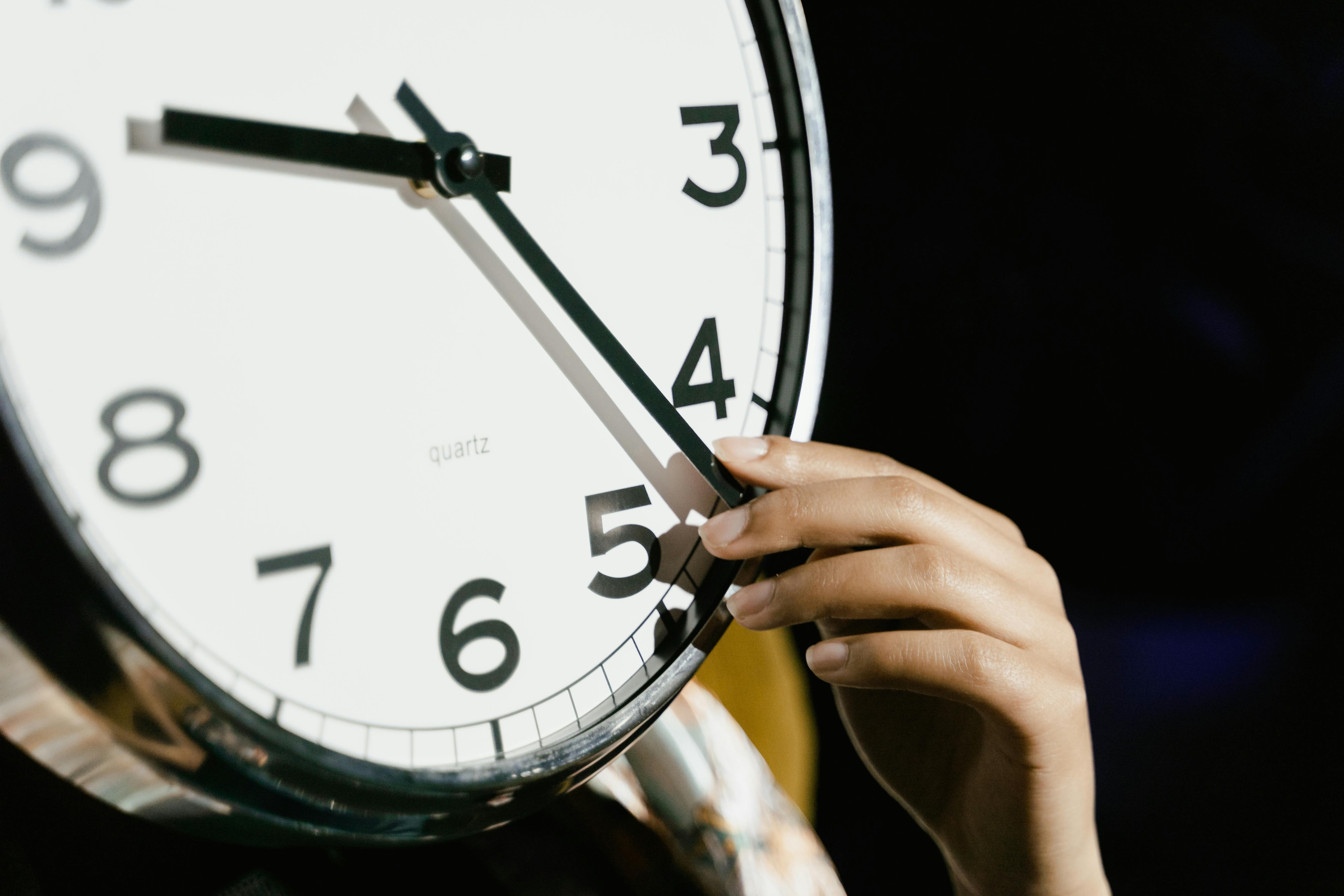 Hand stopping the clock
